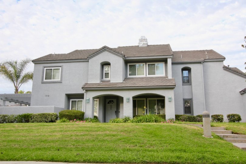 a pleasant day in the garden estates with a house that has roofless top and garden around