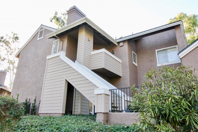 Nice sky view of villa with upstairs and balcony having small garden in Highland View of Irvine