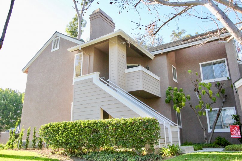 A large staircase attached to a two story housing structure at Highland View in Irvine CA
