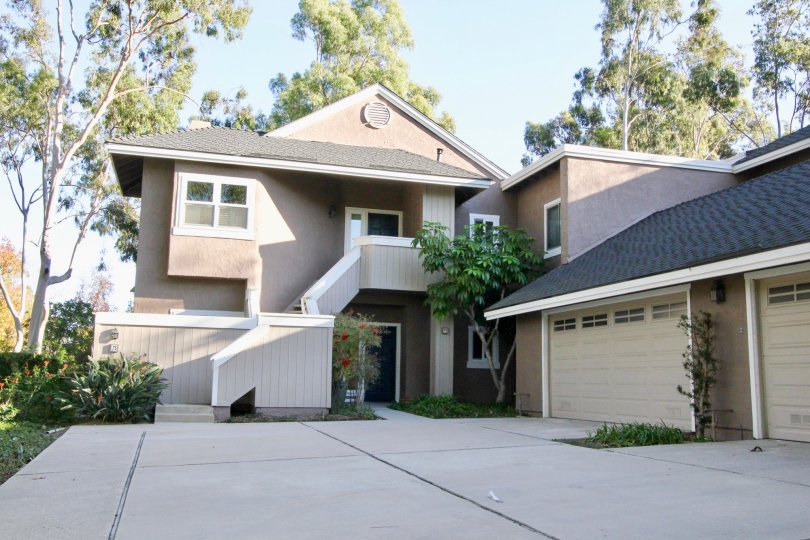 THE FRONT VIEW OF THE HOUSE EMPTY SPACE IN FRONT SIDE, BACKSIDE LOT OF TREES ARE THERE IN IRVINE CITY