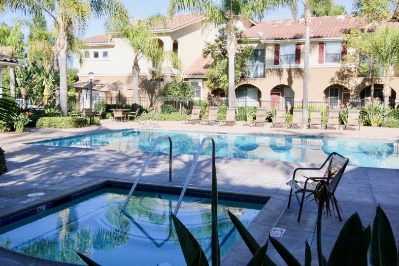 Front to the Apartment in Oak Park has Adult Pool and children's pool with seating chairs