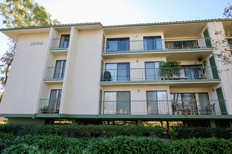 The 2000th apartment in Orangetree Terrace has balconies which has flower pots and chairs