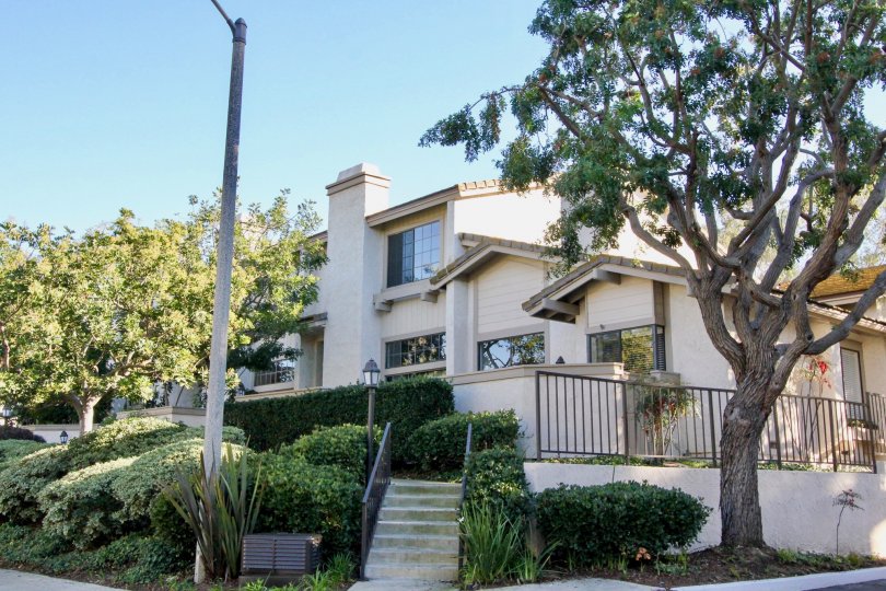 Awesome view of villa with steps and trees in Ridge Townhomes Bren of Irvine