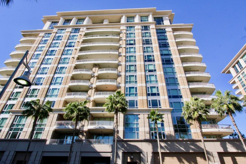 Sunny day looking up at The Plaza Irvine, a 12 story building in Irvine, California