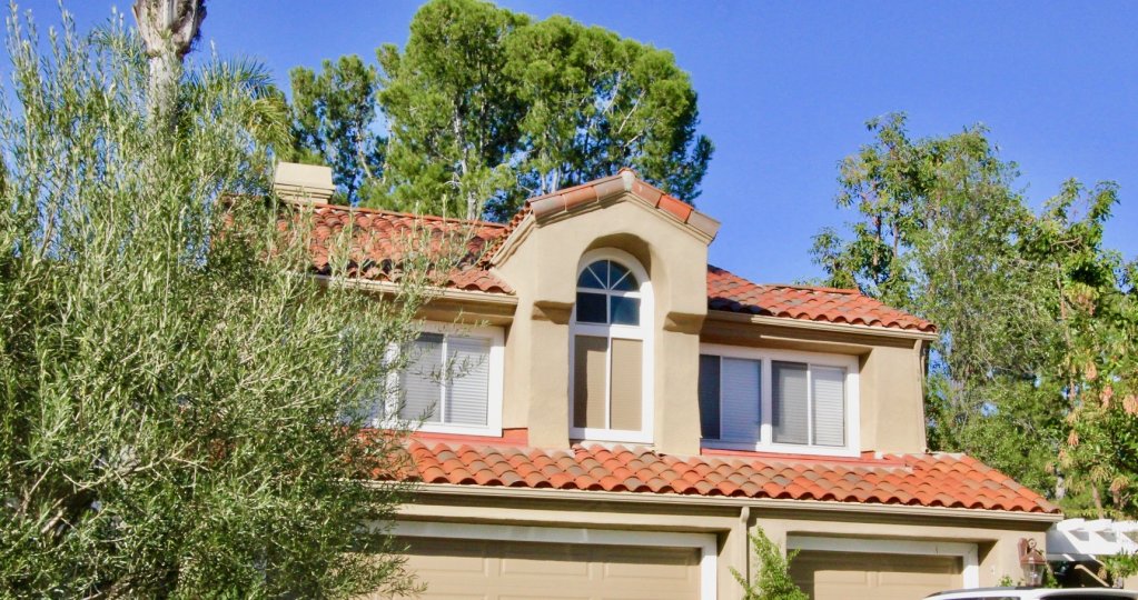 The upper story of a home in Turtle Rock Pointe on a sunny day