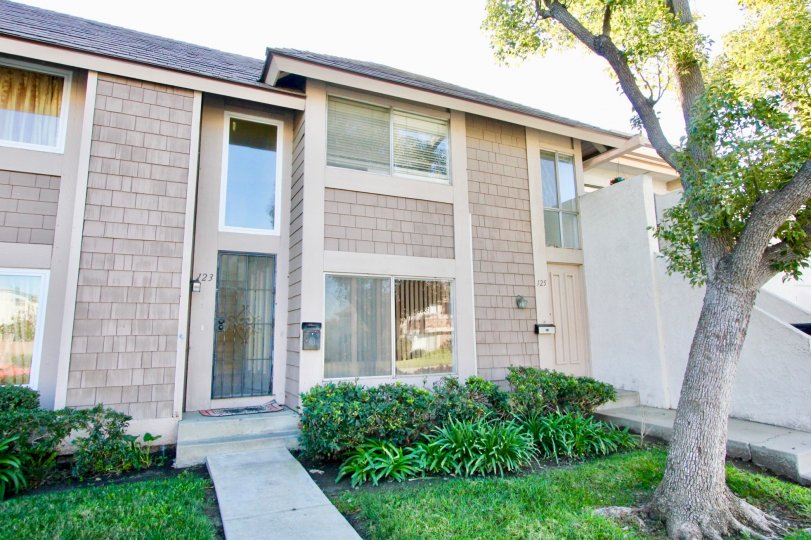 An entry to a home in Walnut Square showing the unit and landscaping