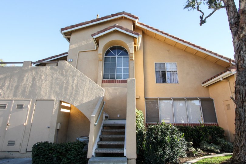 A two-storey unit in the Westpark Tiempo community with slab railings and tiled roofing.