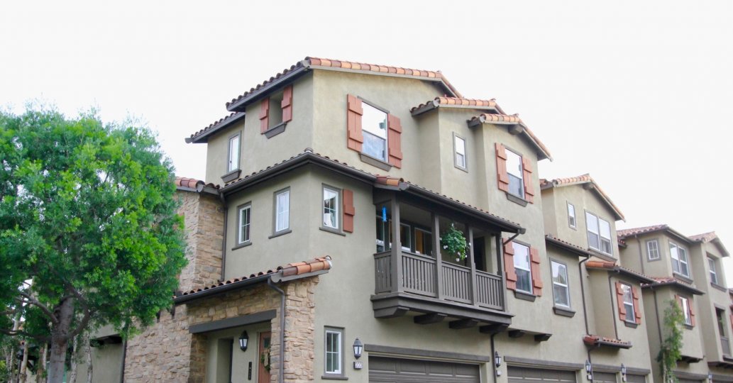 A sunny day in the area of Whispering Glen, outside, condo, balcony, plants. windows, roof