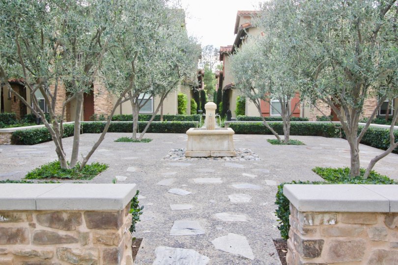 Stone and tree park on a grey day in Whispering Glen in the city of Irvine, California