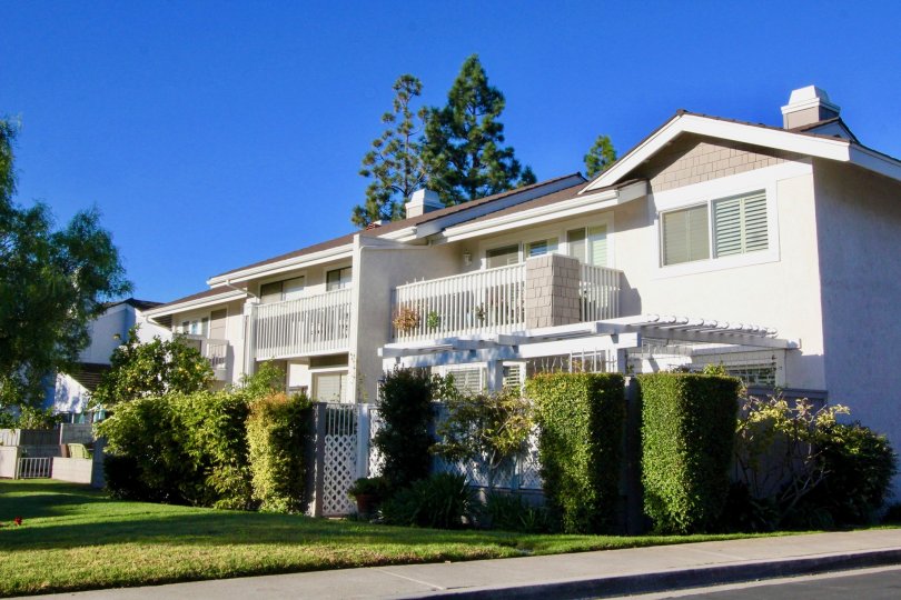 A street view of a home and landscaped yard on a sunny day at Willow Creek