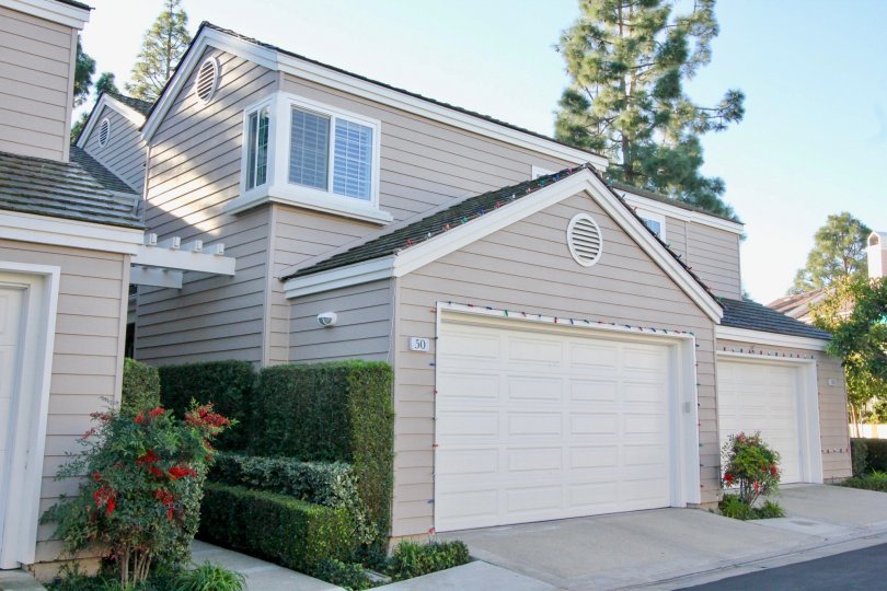 Elegant two-story beige gray home in Woodbridge Cove, Irvine CA