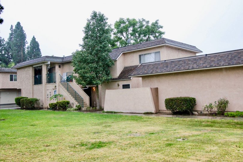 a pleasant day in the fashion knolls with a house that has steps in left side and garden around