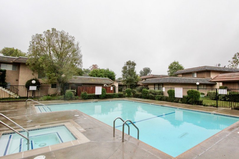 a pleasant day in the fashion walk with a park that has swiming pool and roofless top and garden around