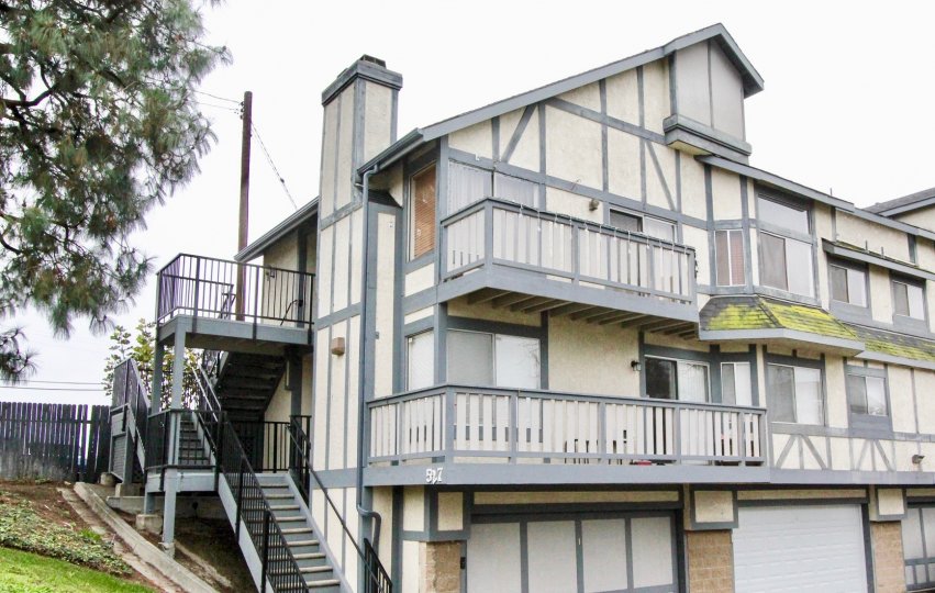 A PLEASANT DAY IN THE Heritage Walnut WITH A BUILDING THAT HAS ROOFLESS TOP AND BALCONY AND STEPS IN SIDE AND DOOR CLOSED