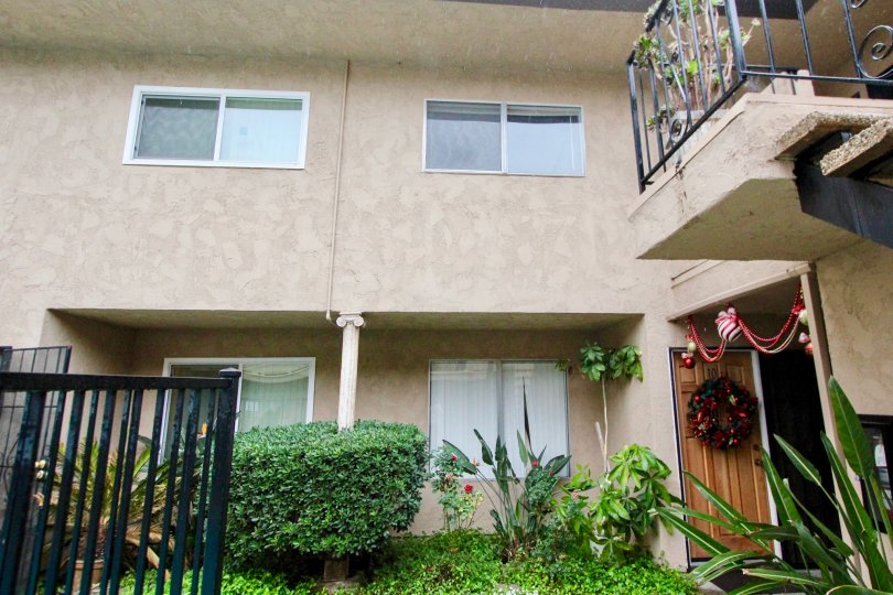 THIS IMAGE SHOWS THE HOUSE WITH LOT OF PLANTS LIKE CROTONS LOCATED IN LA HABRA