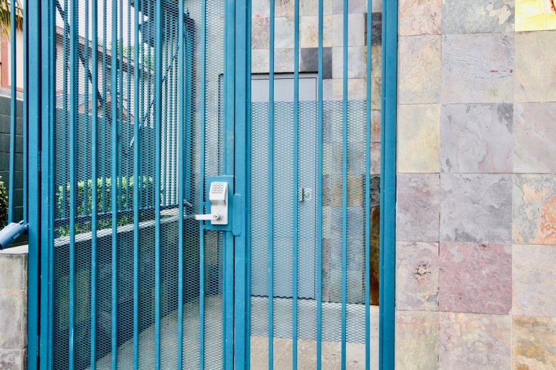 Gate of the House is painted with blue color placed in Mountain View Villas