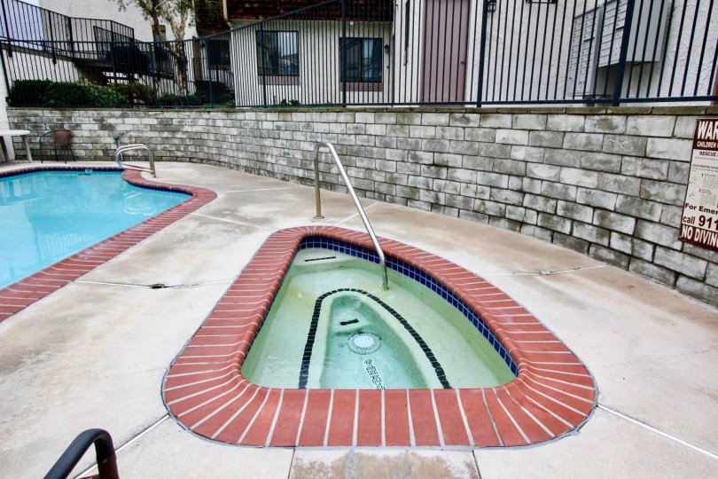 Swimming pool area with clean water and kids pool in Parkside Townhomes of La Habra city of california
