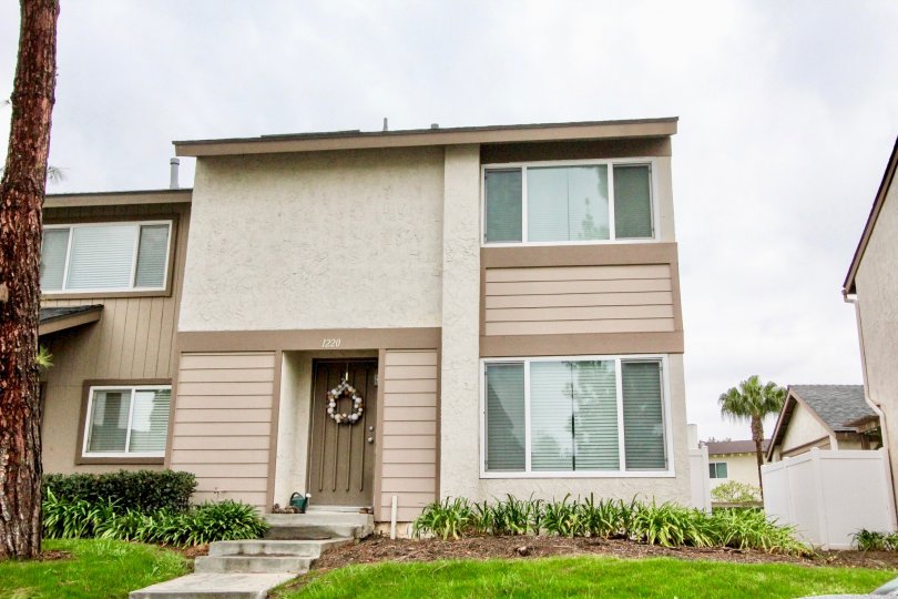 THE HOUSE WITH LAWN, SMALL PLANTS ON THE FRONT, NUMBER ON THE WALL IS LOCATED IN LA HABRA