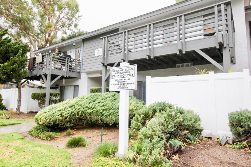 A cottage in woodlake village is in peaceful place with splendid lawn, plants and no parking board