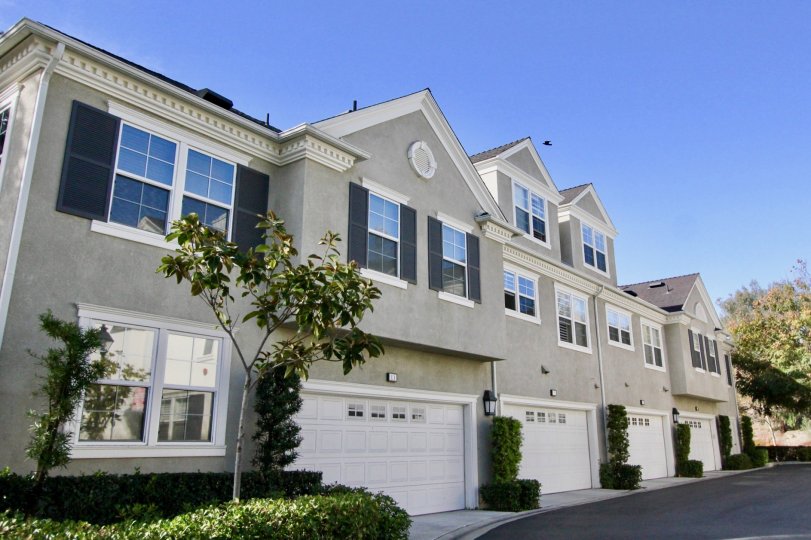 Front view with two car garages and plenty of windows at Aldenhouse in Ladera Ranch, California