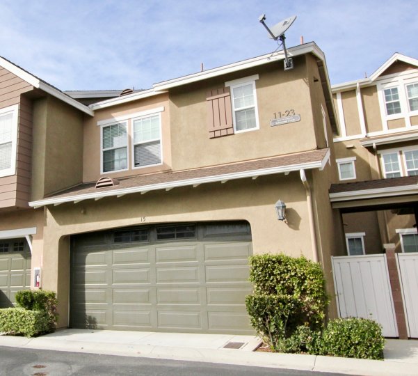 A brown home with a grey garage in Branches community in Ladera Ranch, California.