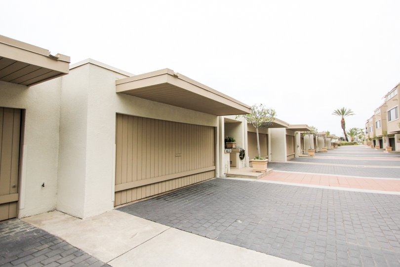 A sunny day in the Laguna Ocean Vista with a path between apartments.