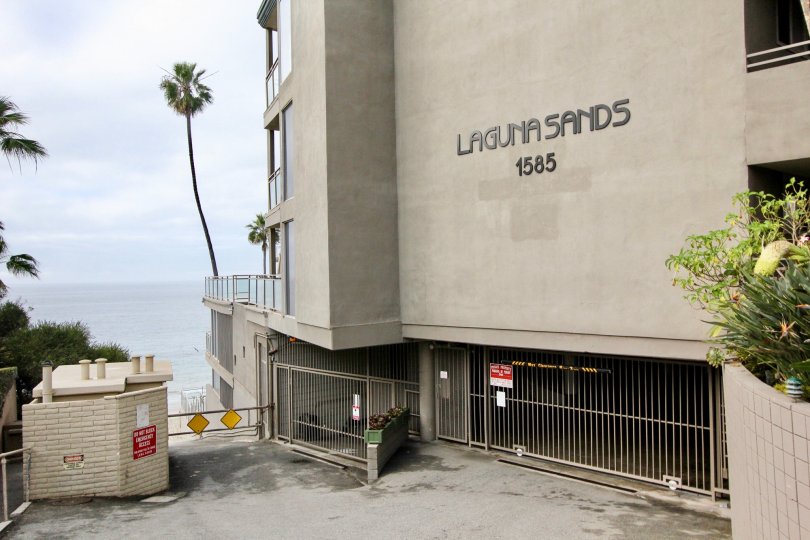 THE 1585 BUILDING IN THE LAGUNA SANDS WITH THE GATE, PLANTS