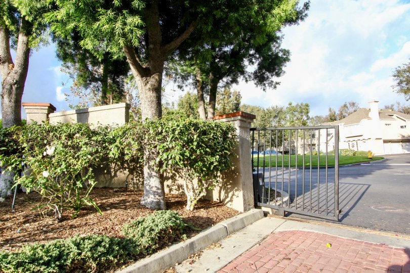A gate is situated in front of a building at Bridgeport Terrace.