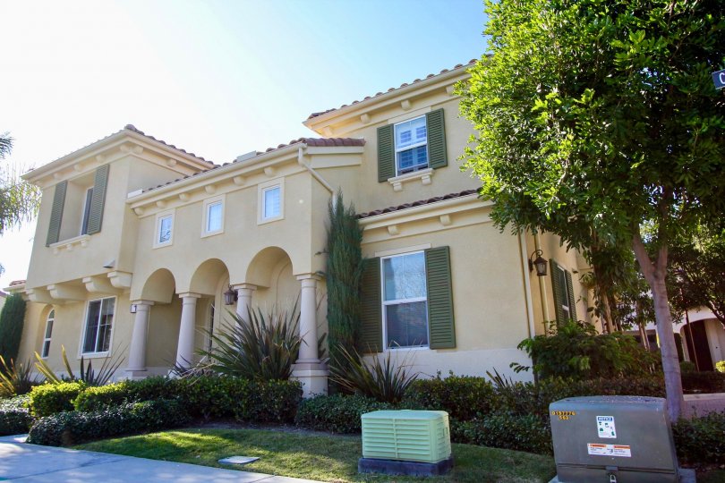 blue sky big detached house and green hedges in Cornerstone