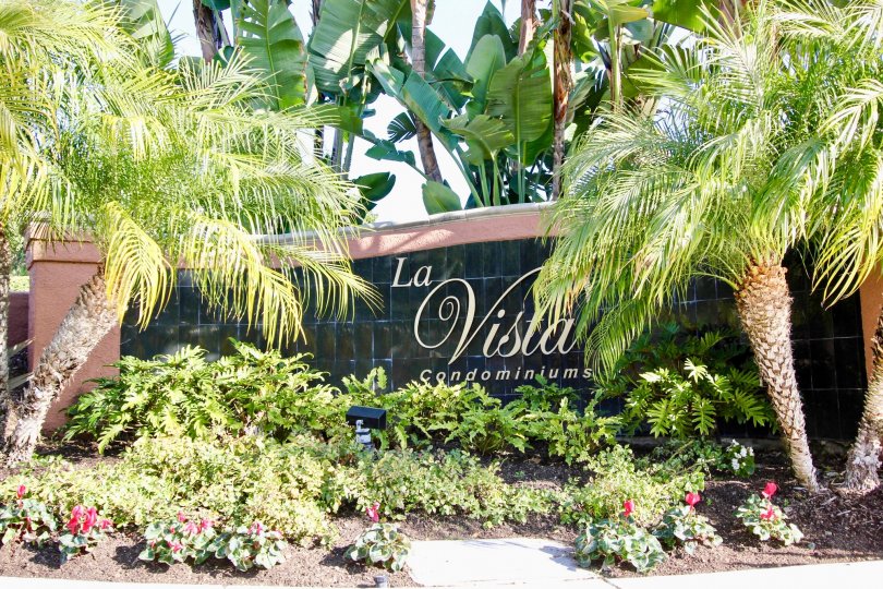 THE VILLAS WITH THE LA VISTA CONDOMINIUMS WALL, PLANTS, TREES