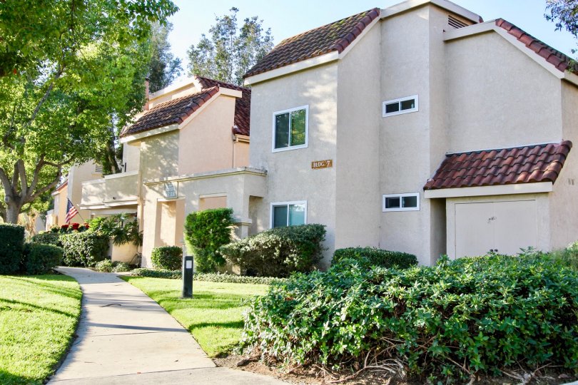 Sunny day on a large homes with bushes around it in Villa Mira community in Laguna Niguel, California.