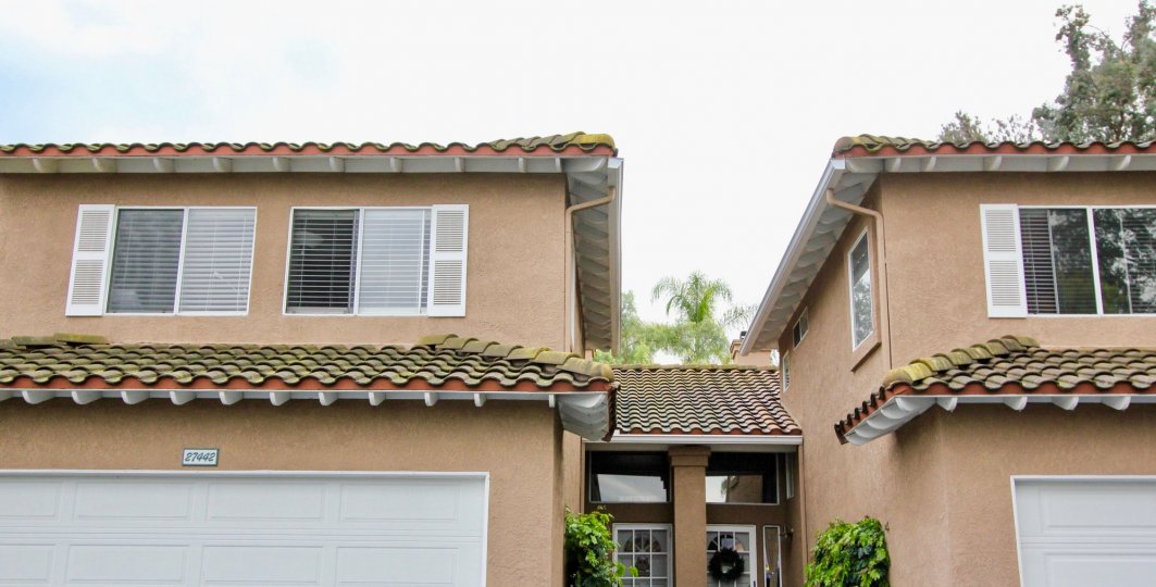 A house with verity windows in the Emerald Pointe II with plants.