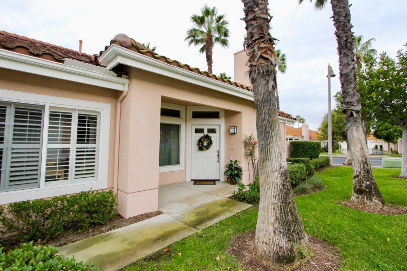 Trees and front door at Palmia Courts 2 in Mission Viejo, CA