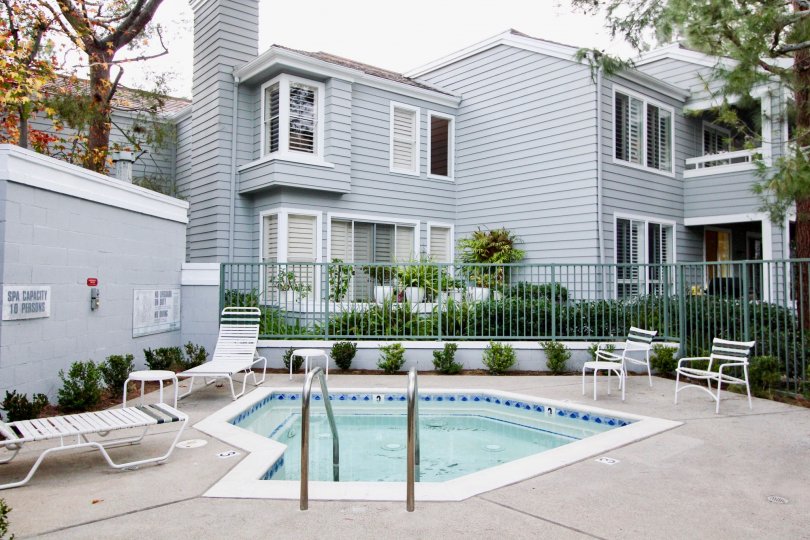 A great day in the Bayridge with a swimming pool in front of an apartment.