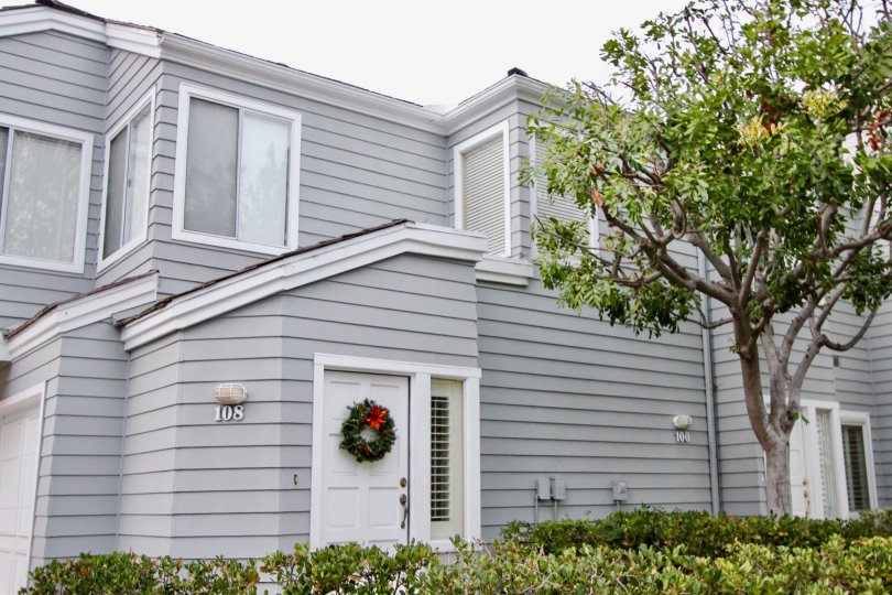 a warm day in the bayridge with building that has 3 windows of color in white