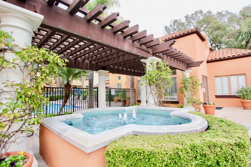 a warm day in the big canyon villas with house that has water land in the garden