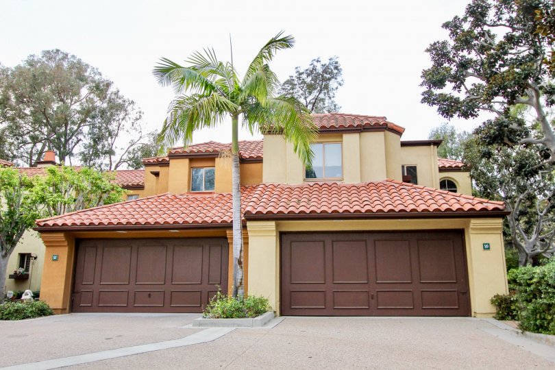 THE 10TH HOUSE IN THE BIG CANYON VILLAS WITH THE TREES, SHUTTERS, PLANTS