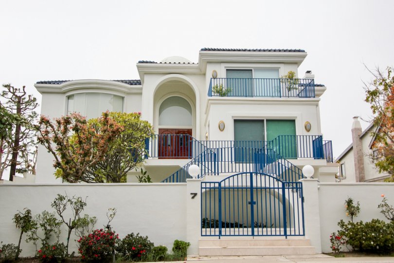 a warm day in the harbor ridge estates with house that has 4 storey and roof in top