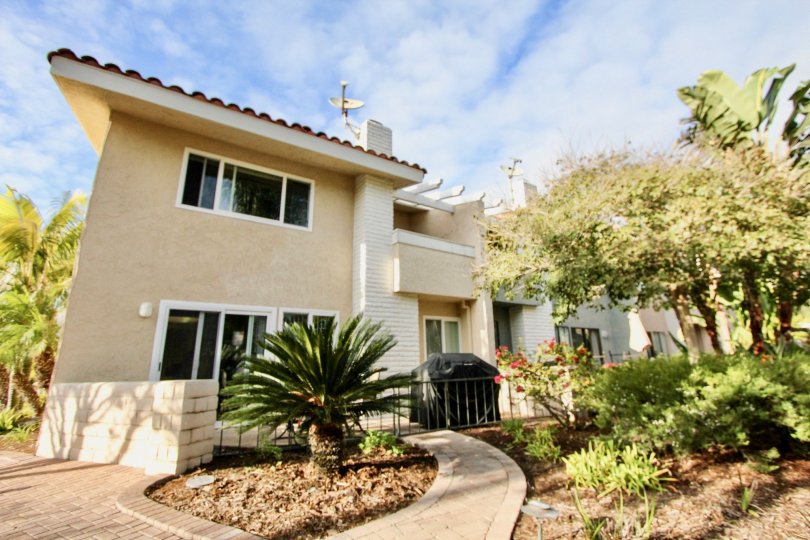 Beautiful front view of the Newport Marina Villas on a sunny day in Newport Beach, CA