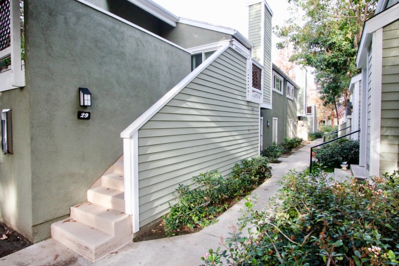 Beautiful neighborhood house with two stories and a lush green front yard