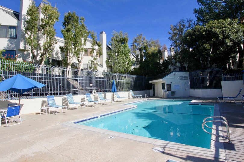 swimming pool decorated with chairs and plants around in Villeurbanne