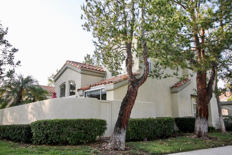 Overcast day, street view of walled residence in Alicante, Rancho Santa Margarita, California