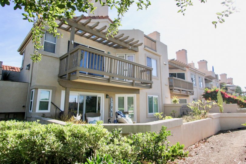 A pergola sits above a balcony at the Brisa Del Lago I community