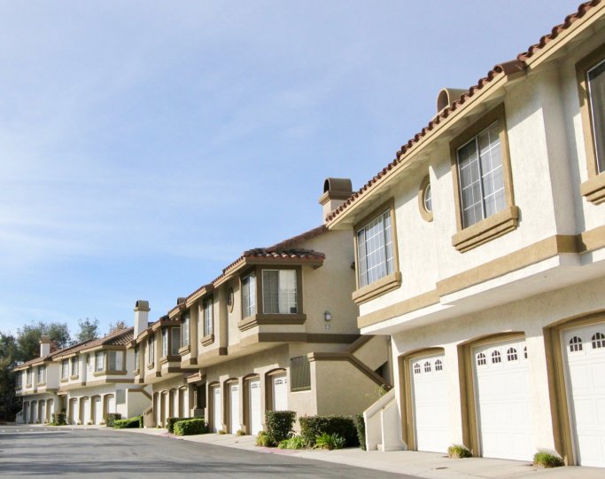 Multi family housing with tiled roofs and garages Rancho Santa Margarita, California's community of Casafina