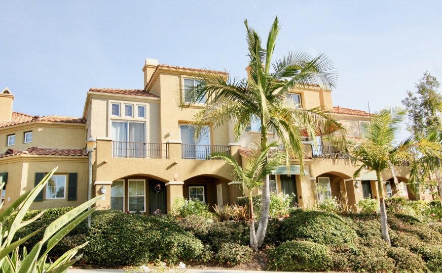 Gorgeous home surrounded by foliage in the Corte Melina neighborhood on a sunny day