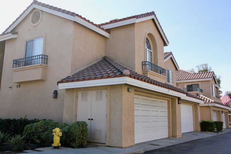 Gorgeous beige villa with red roof and attached garage in Sonoma Court.
