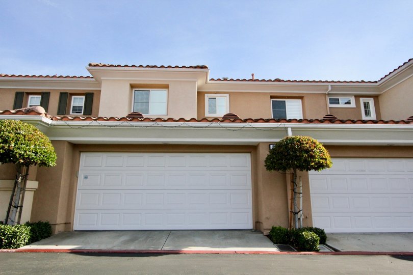 A sunny day in the area of Terracina, garages, windows, trees, roof, condo