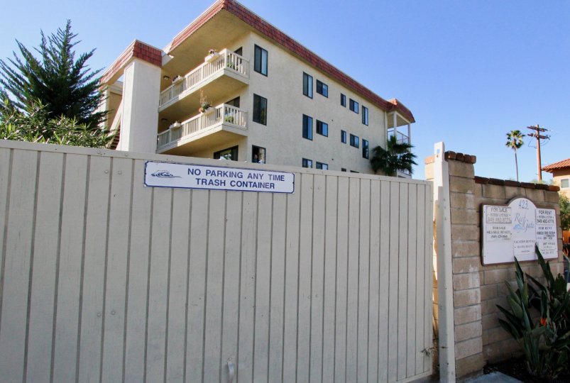A view over a fence of apartment building in Reef Gate West.