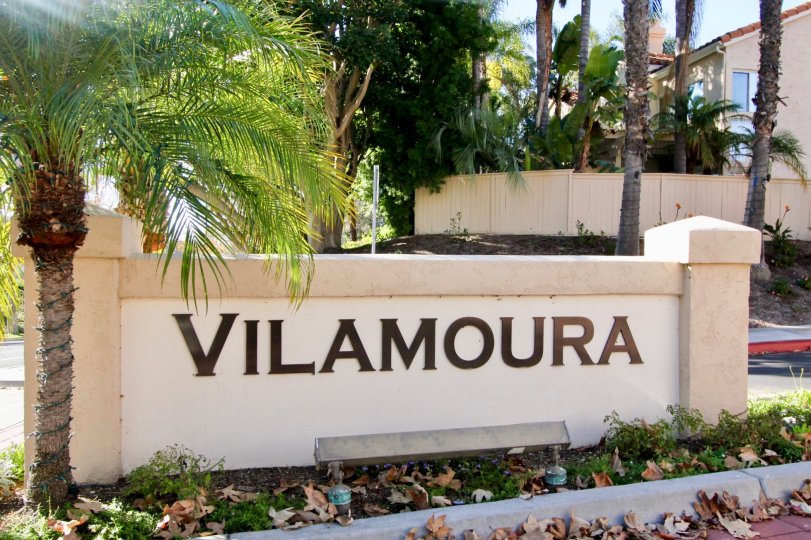 THE WALL IN THE VILAMOURA WITH THE BUILDING, TREES, PLANTS