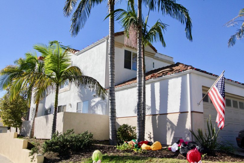 The Villagio in the San Clemente with a house holding a U. S Flag